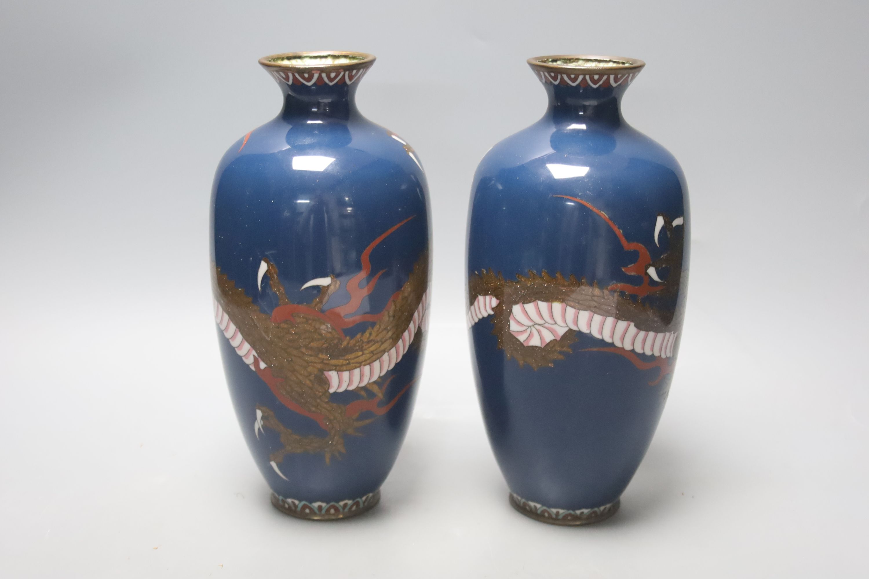 A pair of Japanese cloisonne enamel 'dragon' vases, c. 1900